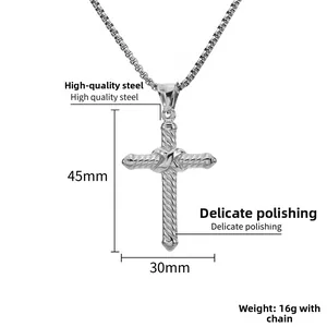 Macro view of polished steel cross pendant showing 45mm height and twisted texture