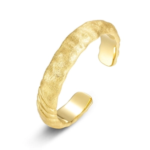 Hammered gold cuff bracelet with adjustable open design and polished metal texture
