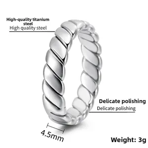 Macro detail of 4.5mm polished titanium steel woven ring showing 3g weight and texture