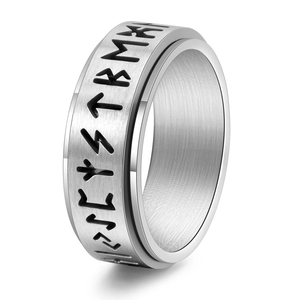 Macro view of rotating stainless steel Runic ring with brushed finish and polished edges