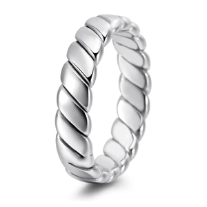 Macro detail of geometric braided rope texture on polished silver titanium steel ring