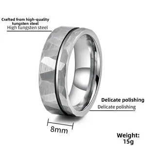 Detail view of 8mm tungsten ring featuring hammered texture and black grooved centerline