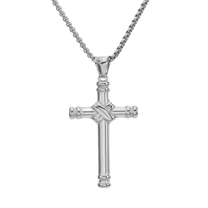 Macro shot of silver cross pendant with cross-band design on a classic box chain
