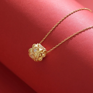 Brushed S925 sterling silver gold-plated necklace with diamond-set hollow ball pendant