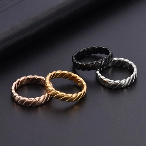 Minimalist geometric braided titanium steel rings in gold, rose gold, silver, and black finishes