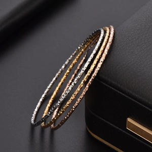 Minimalist 18K gold-plated titanium steel bangles set with shiny geometric texture