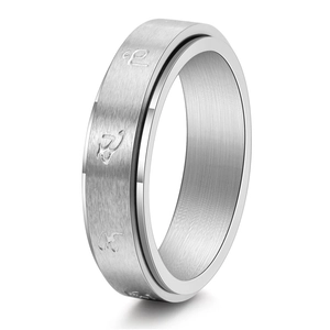 Detail of silver spinner ring with brushed texture and rotating outer band layer