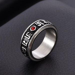Vintage rotating mantra ring in stainless steel with a central red stone for men