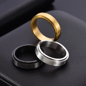 Three-piece set of spinning rings in gold, silver, and black with Sanskrit engravings