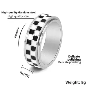 Detail view of 8mm checkerboard spinner ring in high quality polished titanium steel