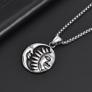 Vintage stainless steel sun and moon pendant necklace with retro celestial relief design