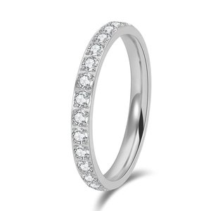 Macro view of silver titanium steel ring with sparkling row of round-cut gemstones