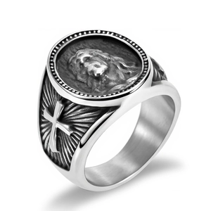 Macro view of vintage stainless steel ring with Jesus relief and side cross details