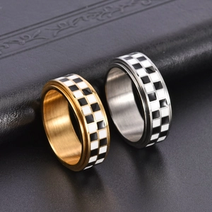 Titanium steel spinner ring with checkerboard pattern in gold and silver finish