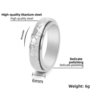 Detail of 6mm hammered titanium steel rotating ring showing its width and 6g weight