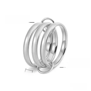 Close-up of interlocking triple-ring band made of polished silver titanium steel