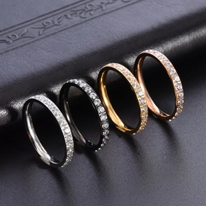 Eternity bands in silver, gold, rose gold, and black with sparkling pave-set stones