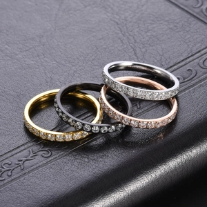 Set of four eternity rings in gold, rose gold, silver and black with full diamond inlay