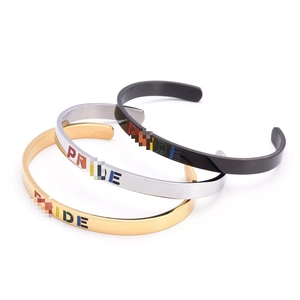Three-piece set of C-shaped titanium steel PRIDE bracelets in gold, silver, and black finishes