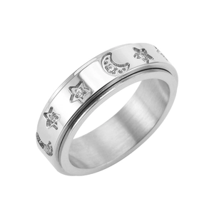 Silver stainless steel spinner ring featuring crystal moon and star cutout design