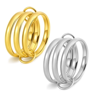 Macro shot of interlocking polished 18K gold and silver stacked titanium rings detail