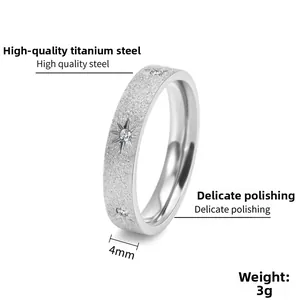 Macro view of 4mm titanium steel ring featuring frosted finish and starburst zircon stones