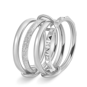 Detail showing interlocking triple rings with zircon pavé and textured finish in silver