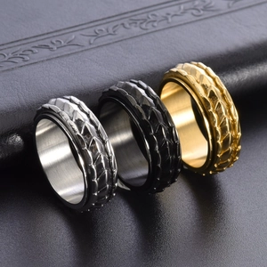 Rotating dragon scale rings set in silver black and gold titanium steel finishes