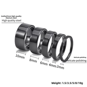 Polished black stainless steel rings in 2mm to 10mm widths shown on a white background