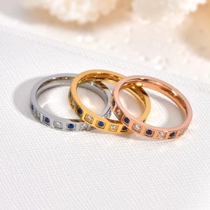 Three-piece CNC checkered ring set with blue and white crystals in gold and silver