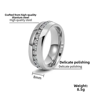 Macro shot of 8mm wide titanium steel ring with single row diamond inlay and polished finish