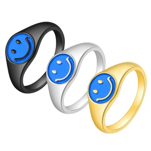 Minimalist titanium steel smiley face rings in gold, silver, and black metal finishes