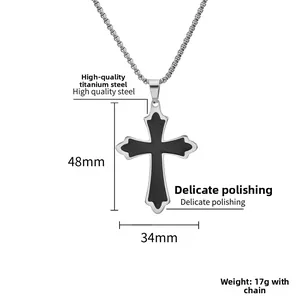 Polished titanium steel cross pendant necklace with black enamel detail measuring 48mm by 34mm