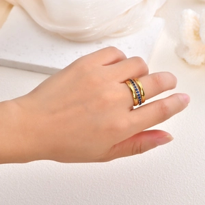 Three-piece 18K gold plated ring set with navy blue gemstone and cubic zirconia