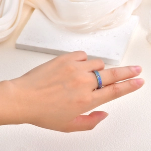 Macro detail of sun flower star ring with holographic emery finish on model hand