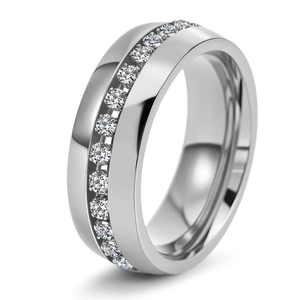 Macro detail of silver titanium ring featuring a channel set of round sparkling zircons