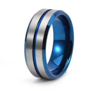 Macro detail of 8mm tungsten ring showing brushed grey surface and blue grooved center