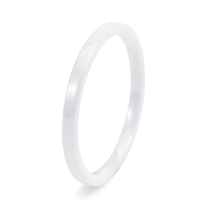Macro detail of high-polish white ceramic minimalist ring with smooth surface