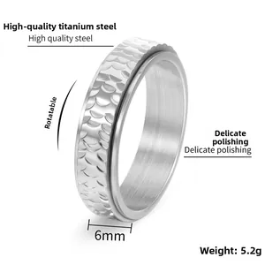 Close-up of 6mm spinner ring with hammered honeycomb texture in polished titanium steel