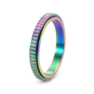 Close-up of rainbow titanium steel rotating ring featuring industrial knurled texture