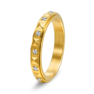 Rotating gold titanium ring with pyramid studs and pavé diamonds at a 45-degree angle