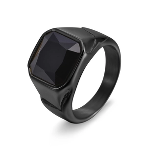 Detail view of a men's matte black stainless steel ring with square faceted black gem