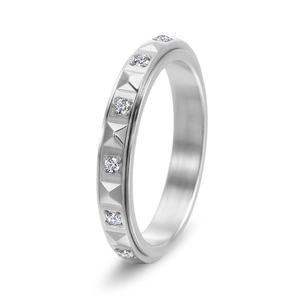 Modern spinning titanium steel ring with pyramid studs and pavé diamonds on white background
