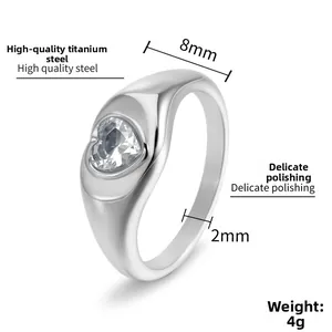 Detailed macro view of heart-shaped crystal on 8mm wide polished titanium steel ring
