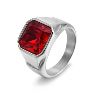 Detail of a men's stainless steel ring with a large square-cut red synthetic ruby stone