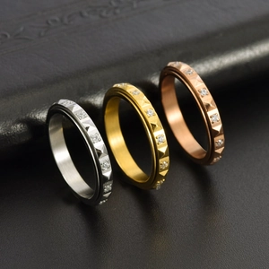Three-color pyramid studded titanium steel spinner rings with zirconia for women