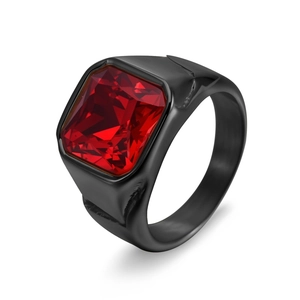 Macro shot of men's black stainless steel ring featuring a large red rectangular gemstone