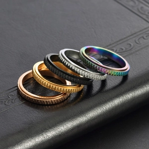 Minimalist textured spinner rings in rose gold, gold, black, silver and rainbow finishes