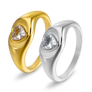 Detailed view of gold and silver heart-shaped zircon rings in polished finish