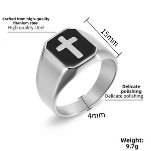 Detail view of titanium steel ring with black rectangular inlay and silver cross pattern